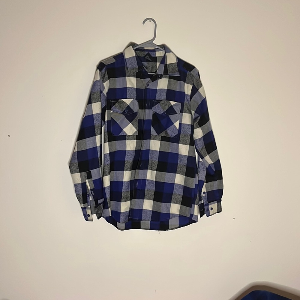 A blue, and black flannel. Worn a lot.